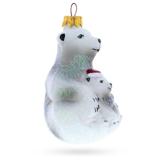 a white bear ornament with a gold cap and silver glitter