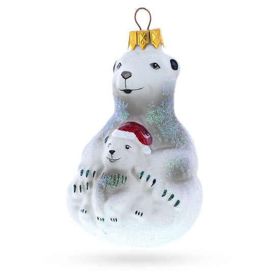 a white bear and a baby christmas ornament