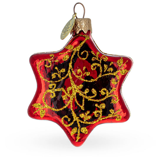 a red and gold star shaped ornament