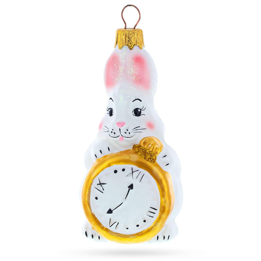 a white bunny with a gold clock