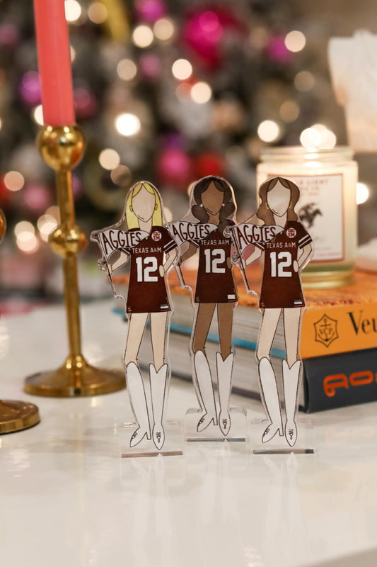 a group of cut out paper dolls