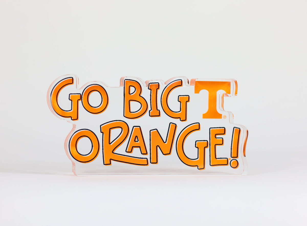 a clear sign with orange text