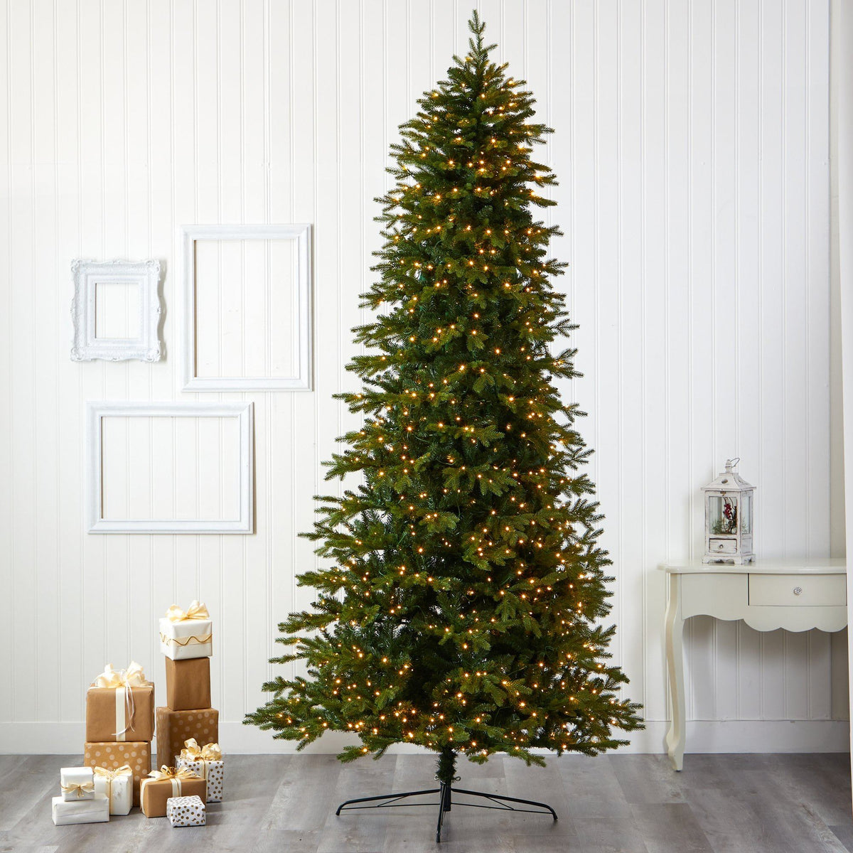a christmas tree with lights and presents
