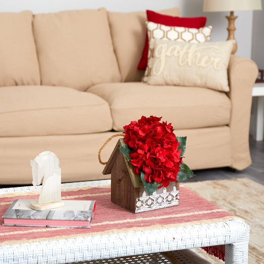 a table with a flower and books on it