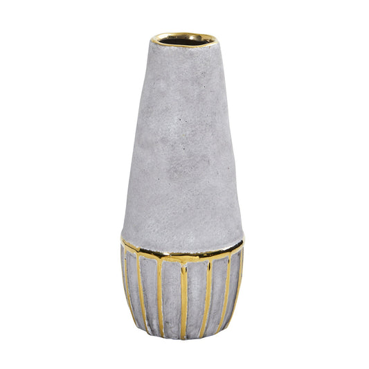 a white and gold vase
