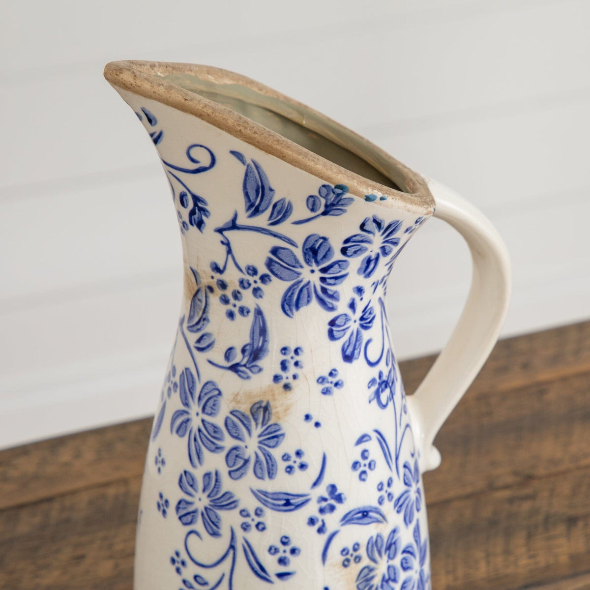 a vase with blue and white flowers