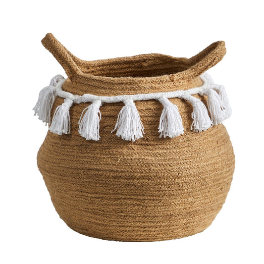 a basket with white tassels