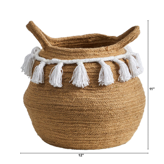 a large woven basket with white tassels