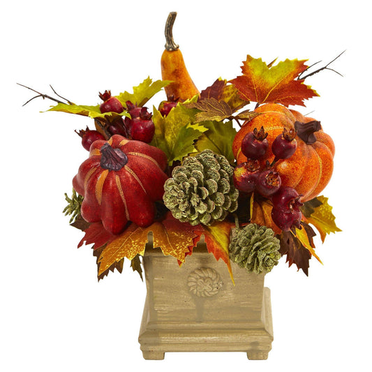 a vase with fake fruits and leaves
