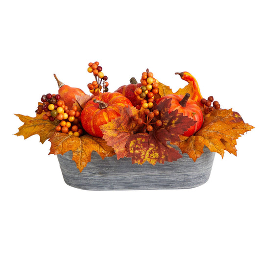 a basket of pumpkins and leaves