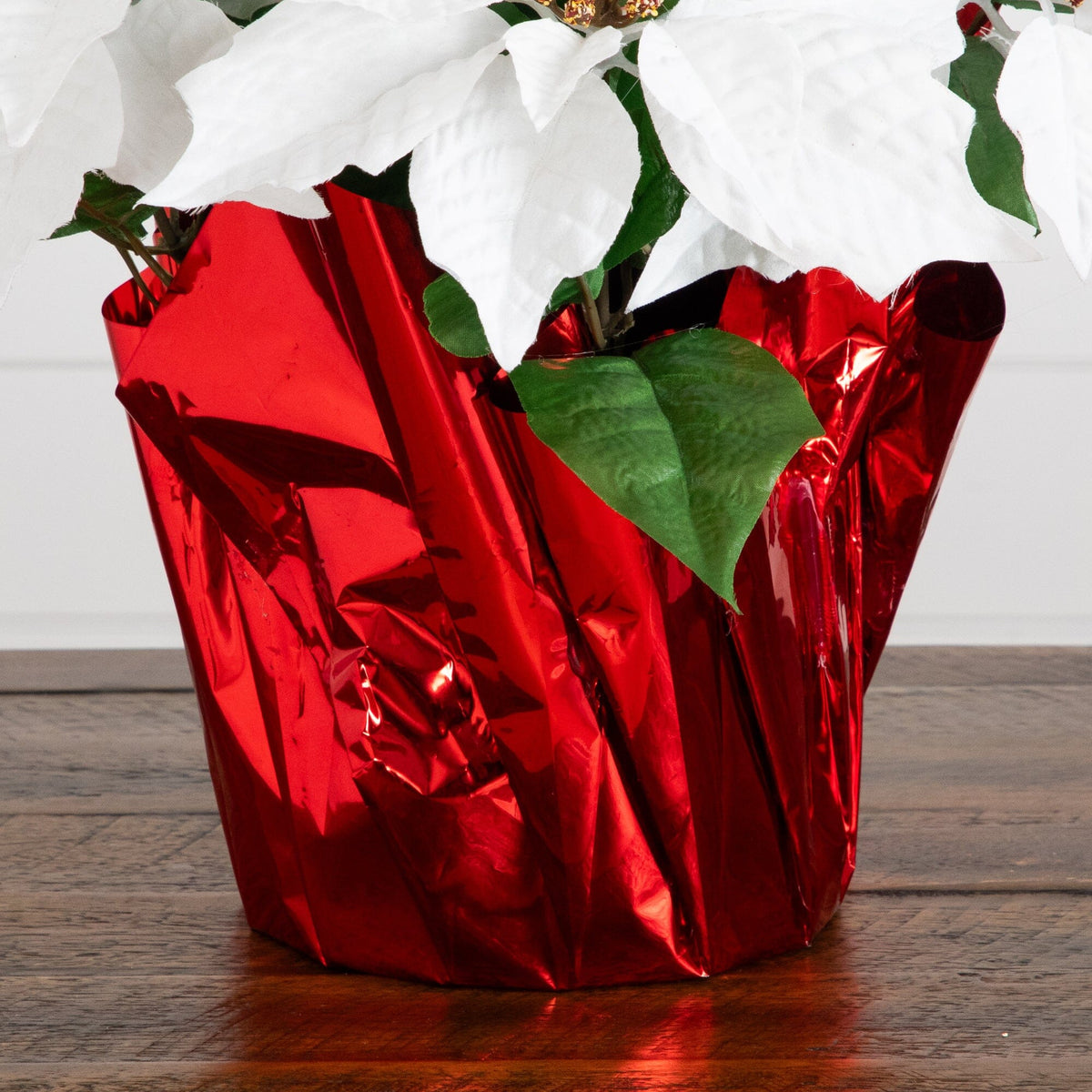 a white flowers in a red wrapper