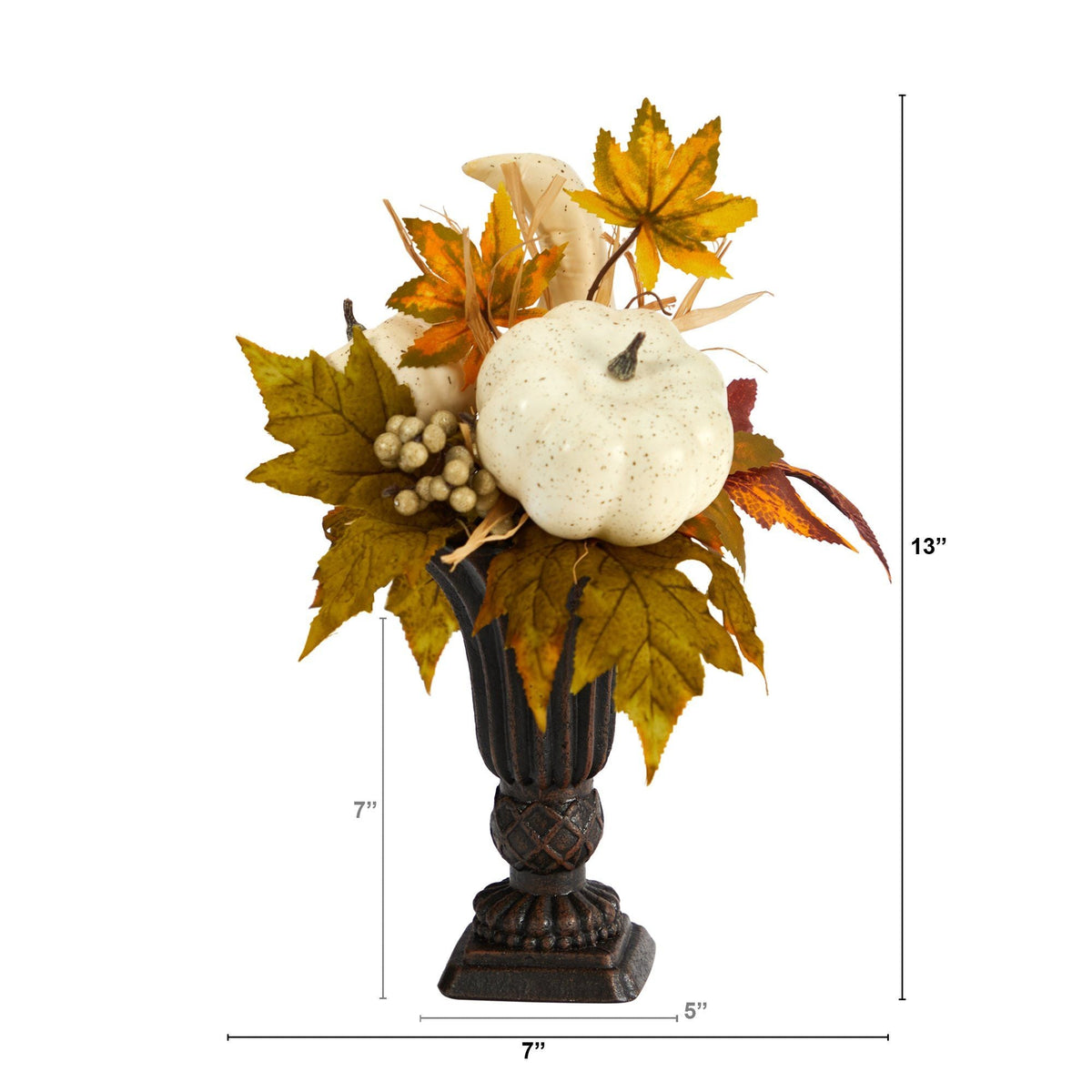 a small vase with a white pumpkin and leaves