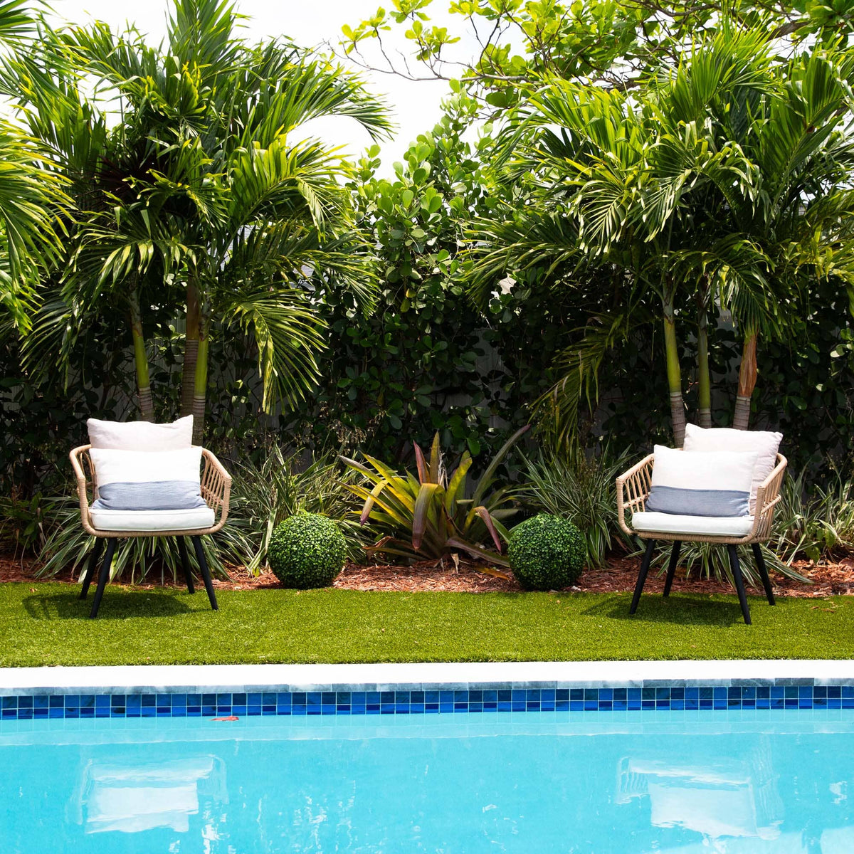 chairs next to a pool
