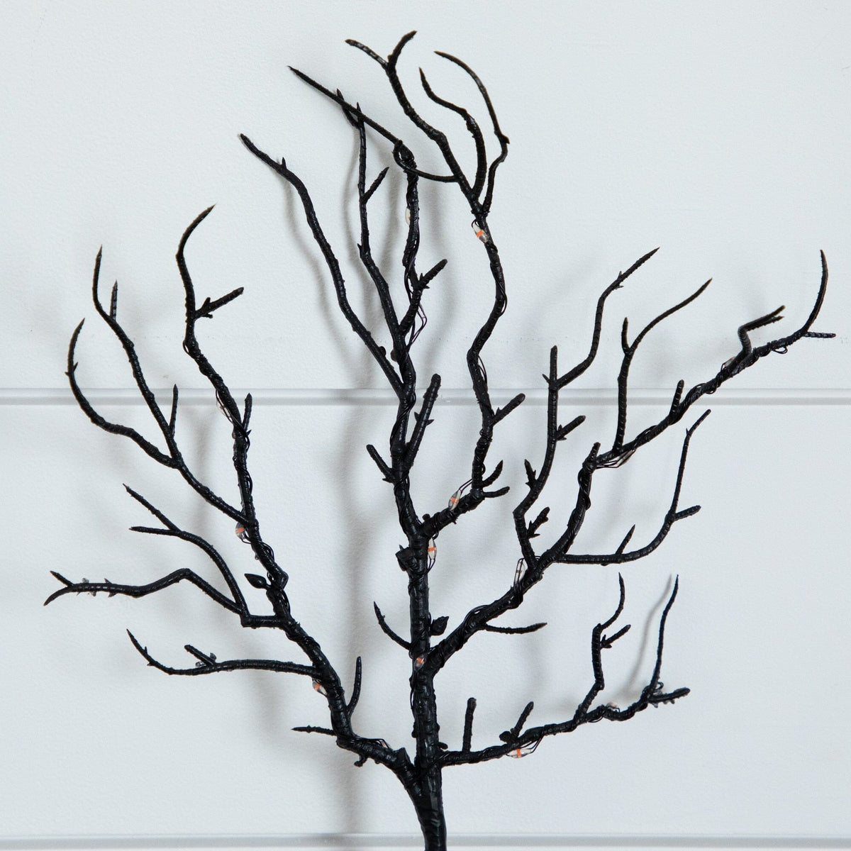 a black tree branch on a white background