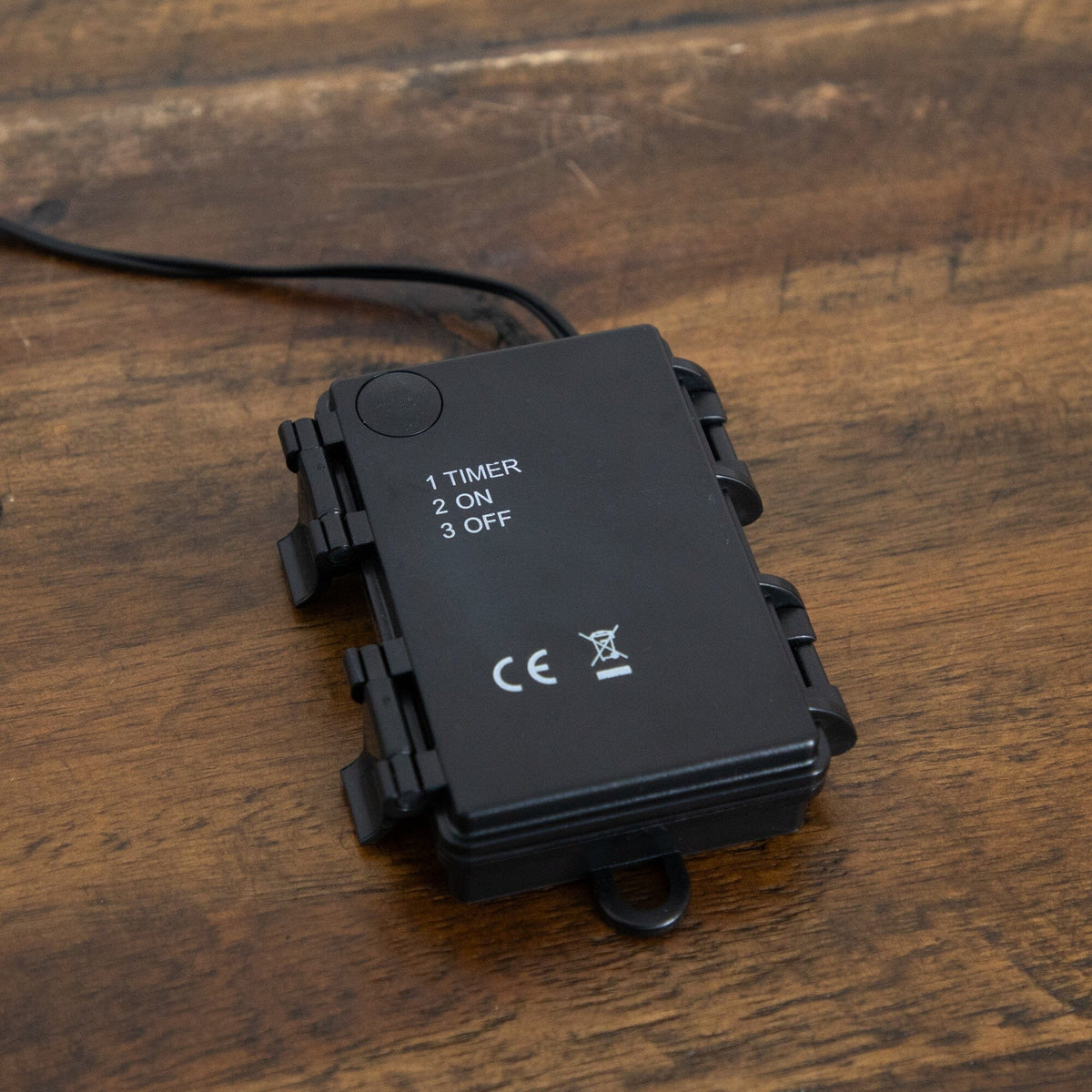 a black device with a wire