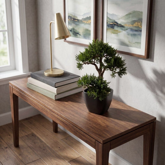 a table with a potted plant and a lamp on it
