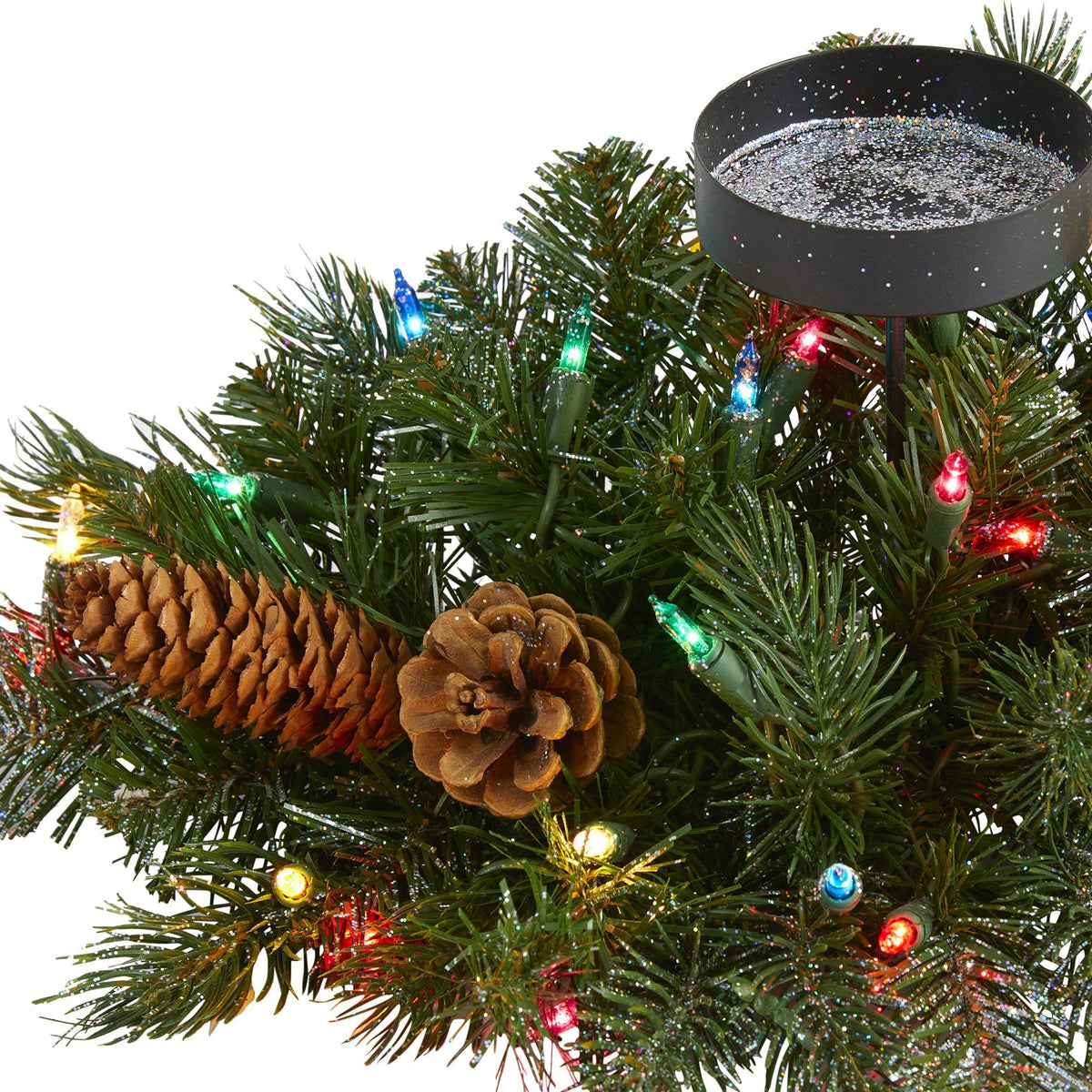 a pinecone and lights on a tree