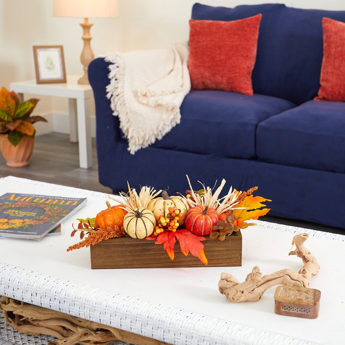 a table with a blue couch and a blue sofa