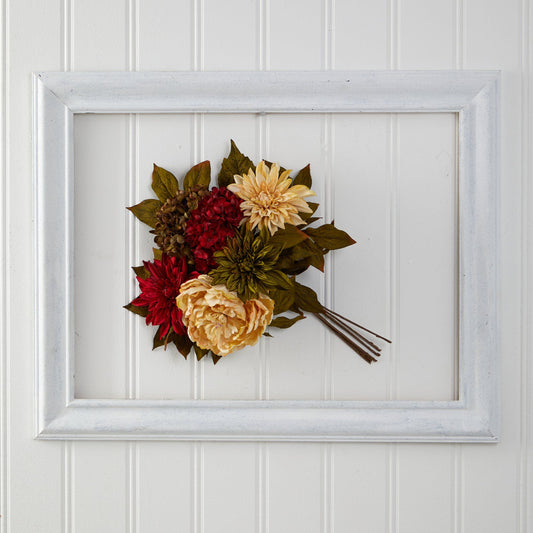 a bouquet of flowers in a white frame