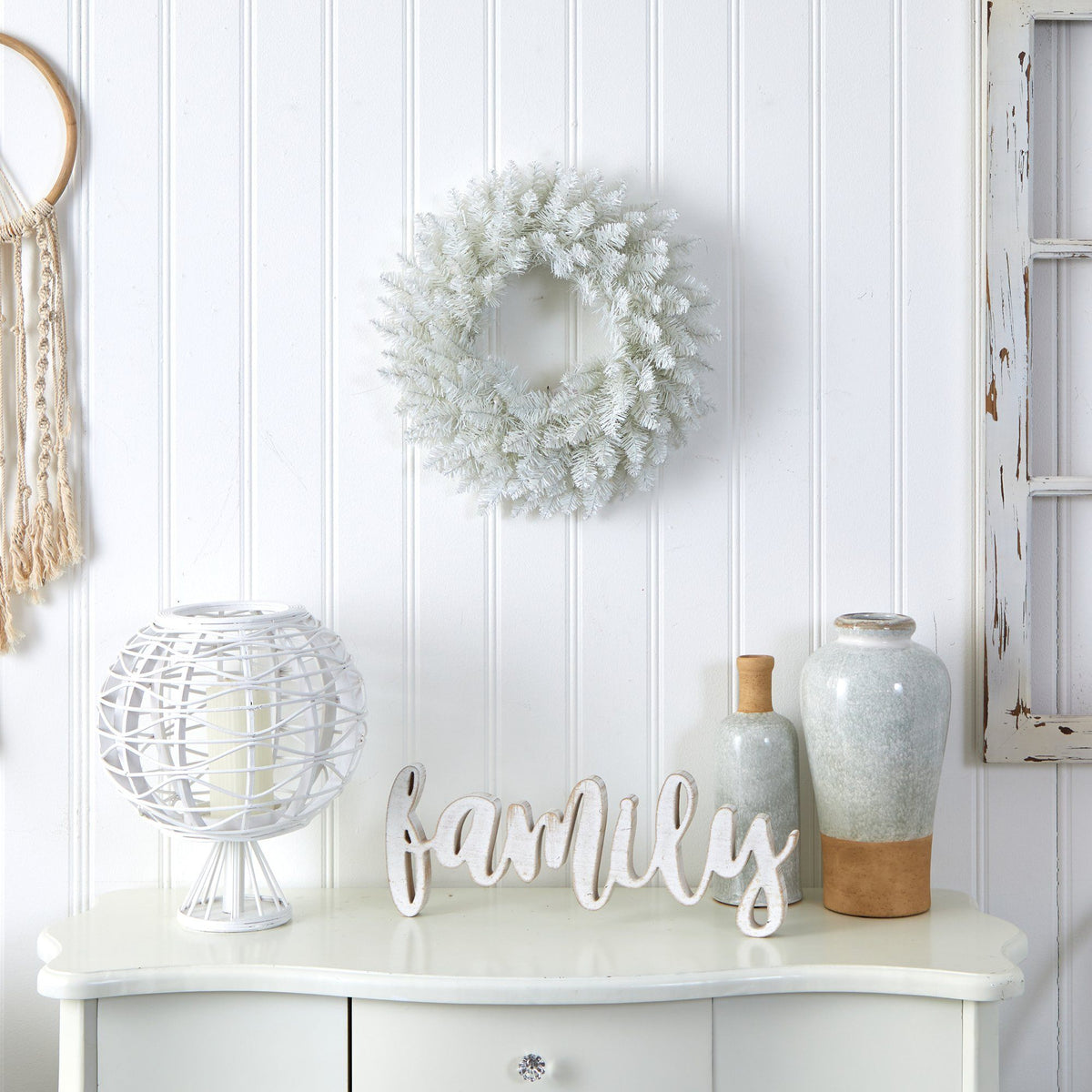 a white table with a wreath on it