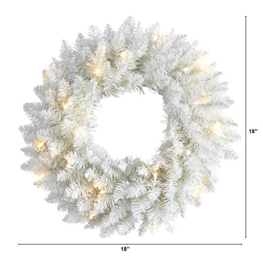 a white wreath with lights