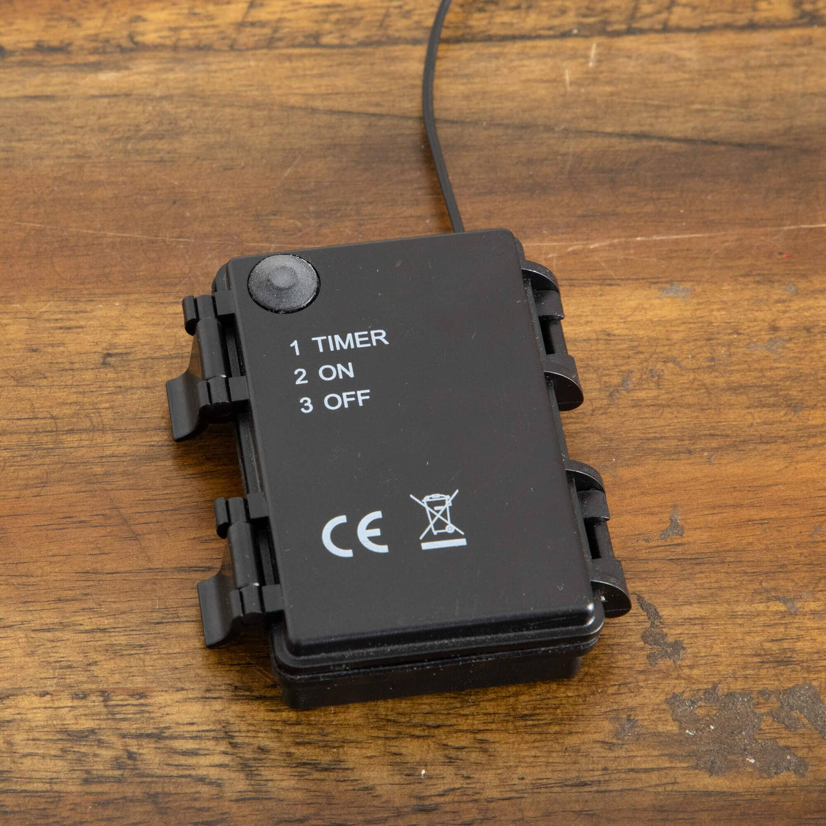 a black device with a wire