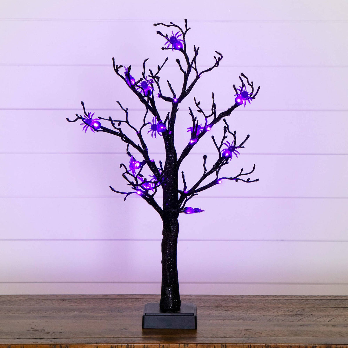 a tree with purple lights