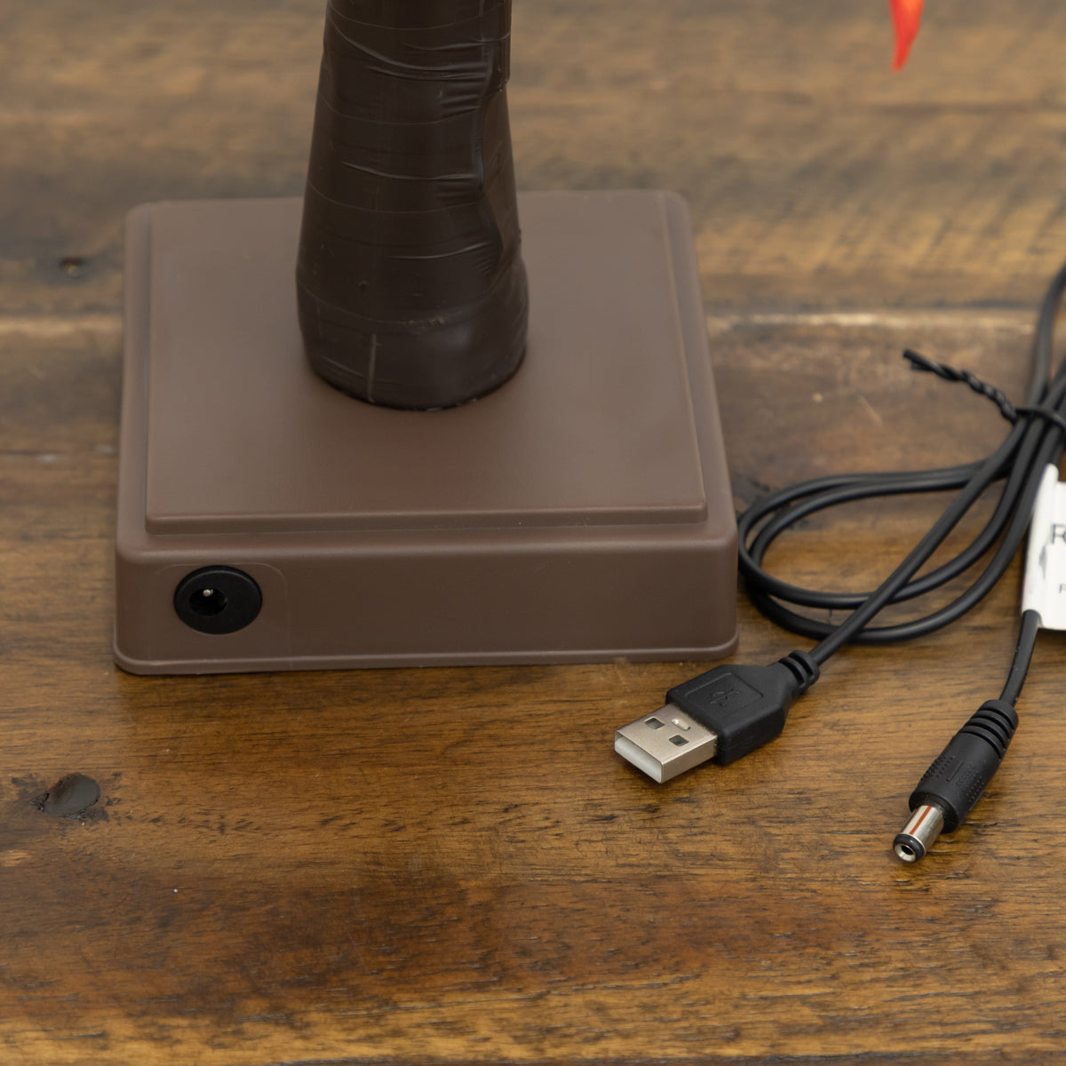 a usb cable next to a brown object