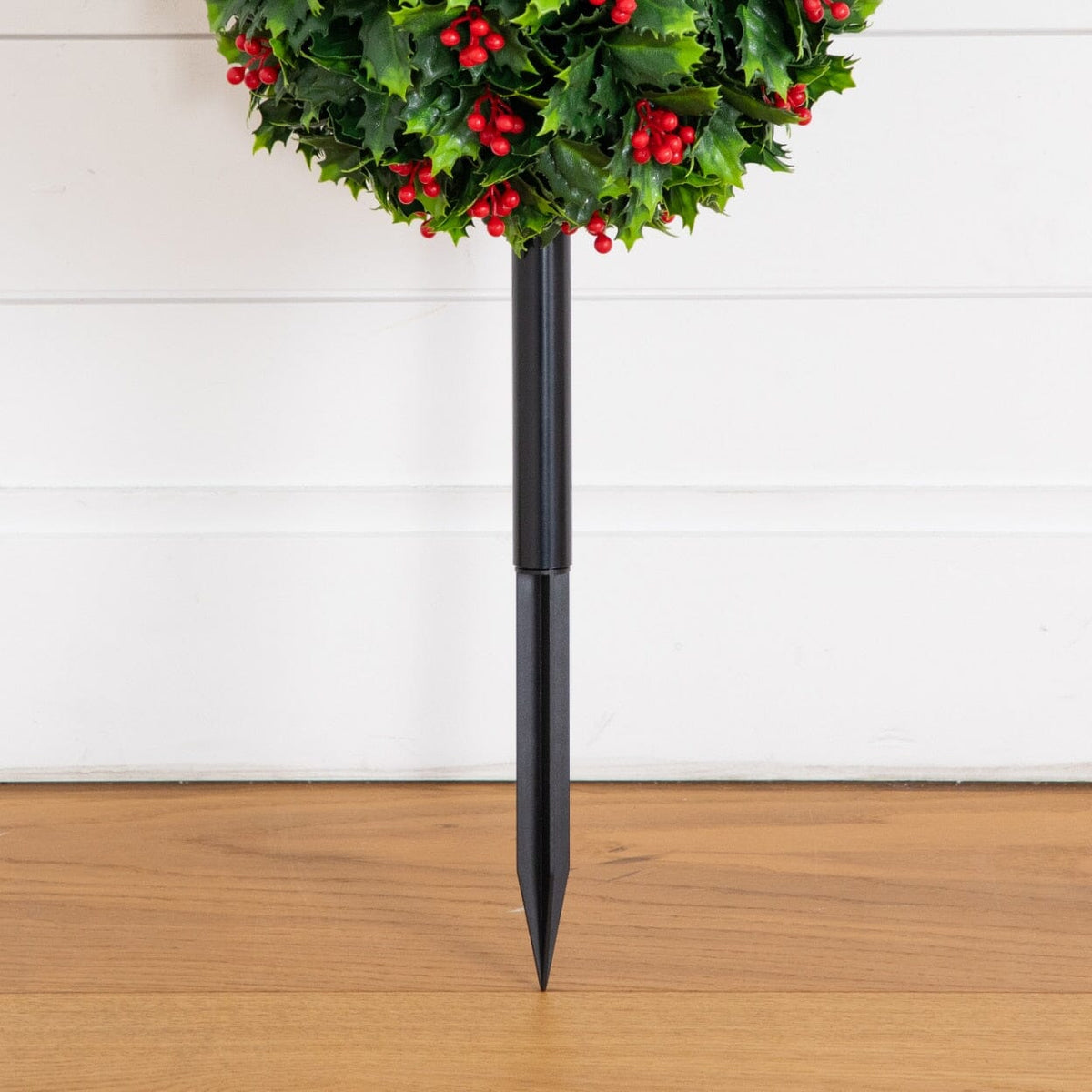 a decorative plant on a pole