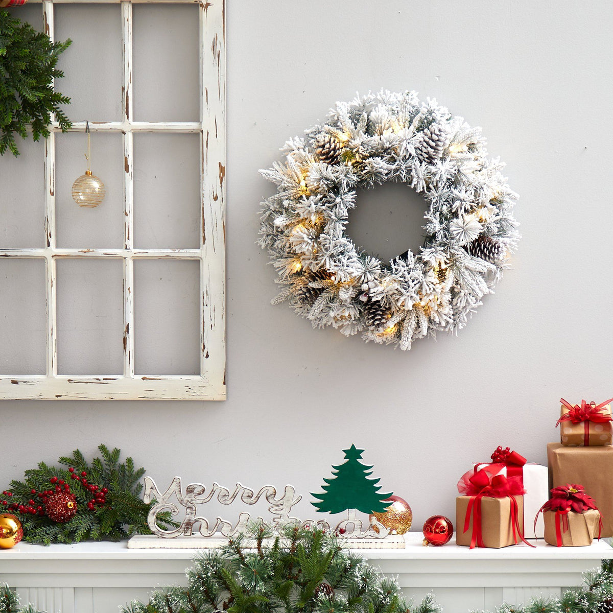 a wreath and presents on a shelf