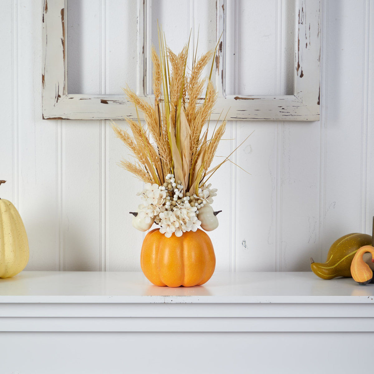 a pumpkin with wheat in it