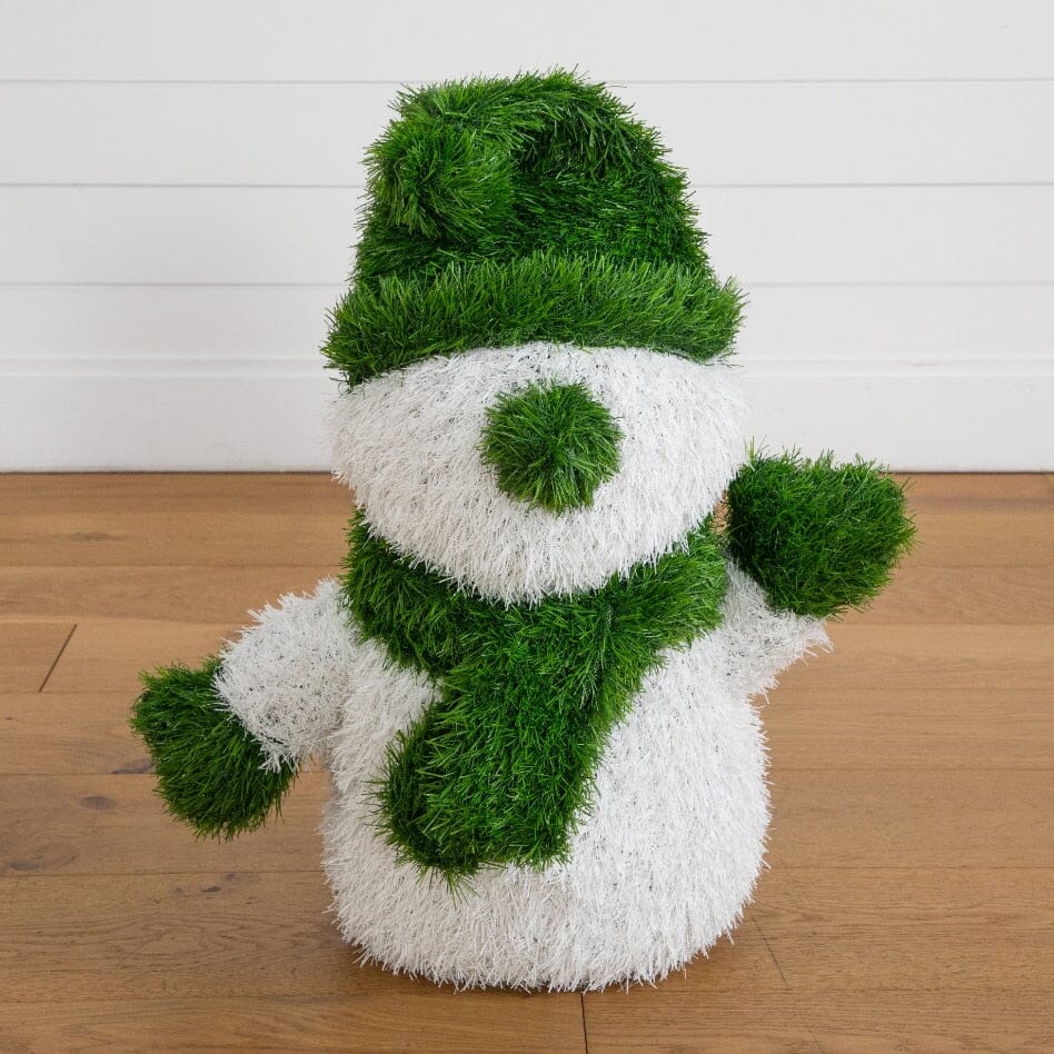 a snowman made of grass