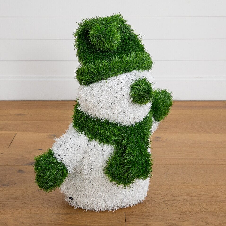 a snowman made of grass
