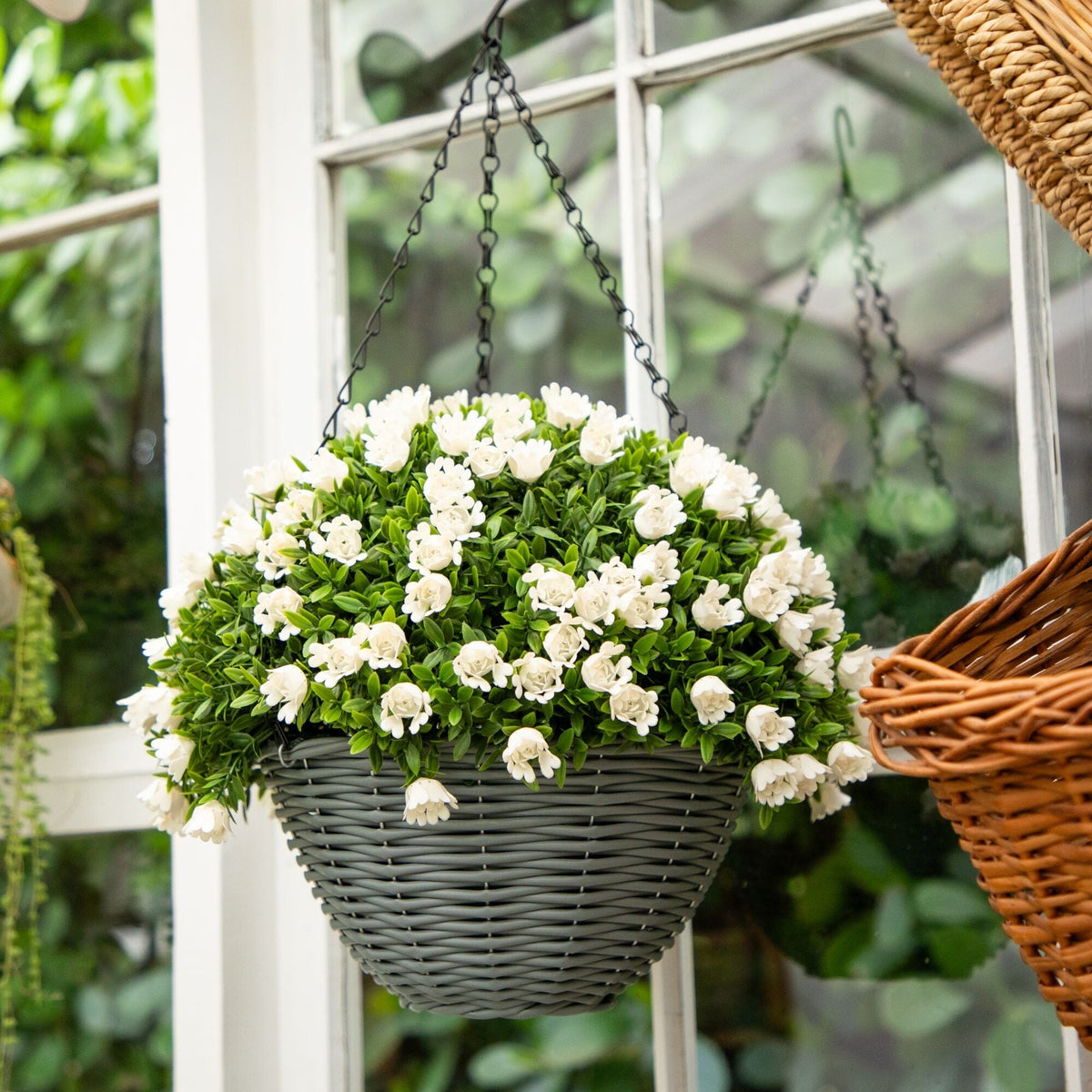 a basket of flowers from a window