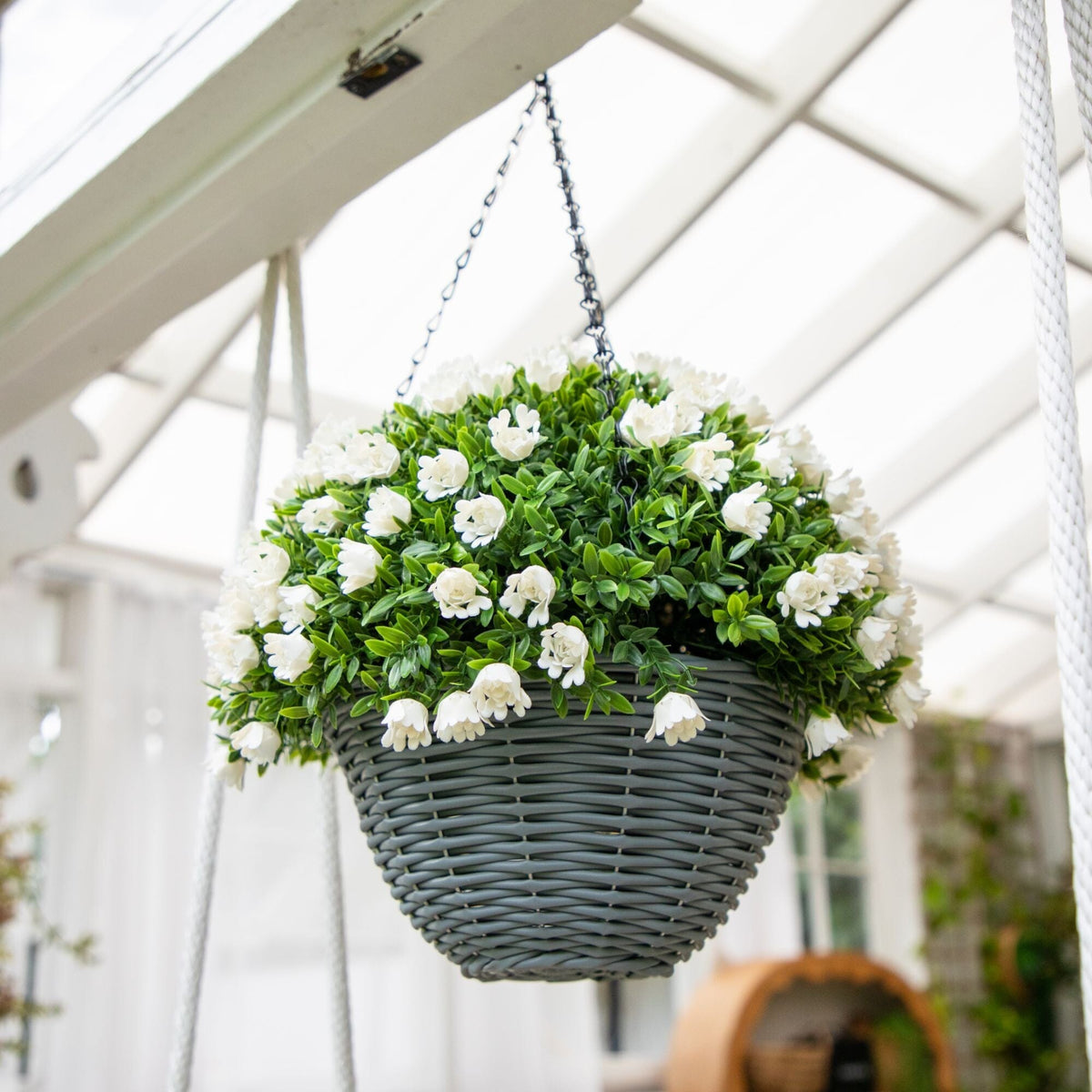 a basket of flowers from a ceiling