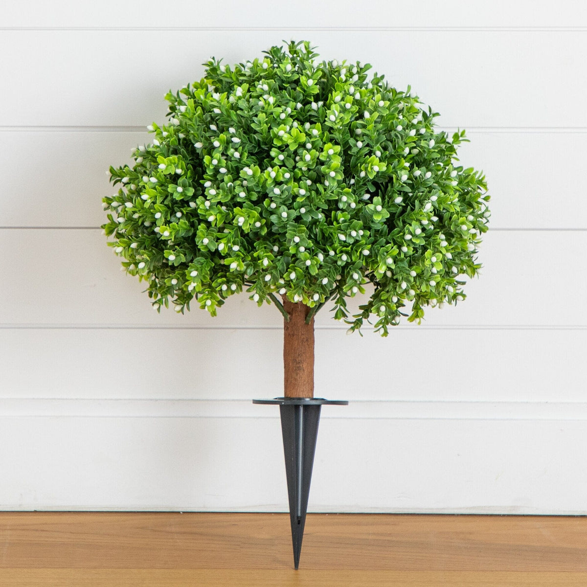 a small tree with a metal tip
