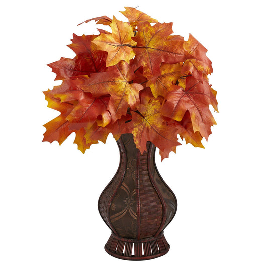 a vase with leaves in it