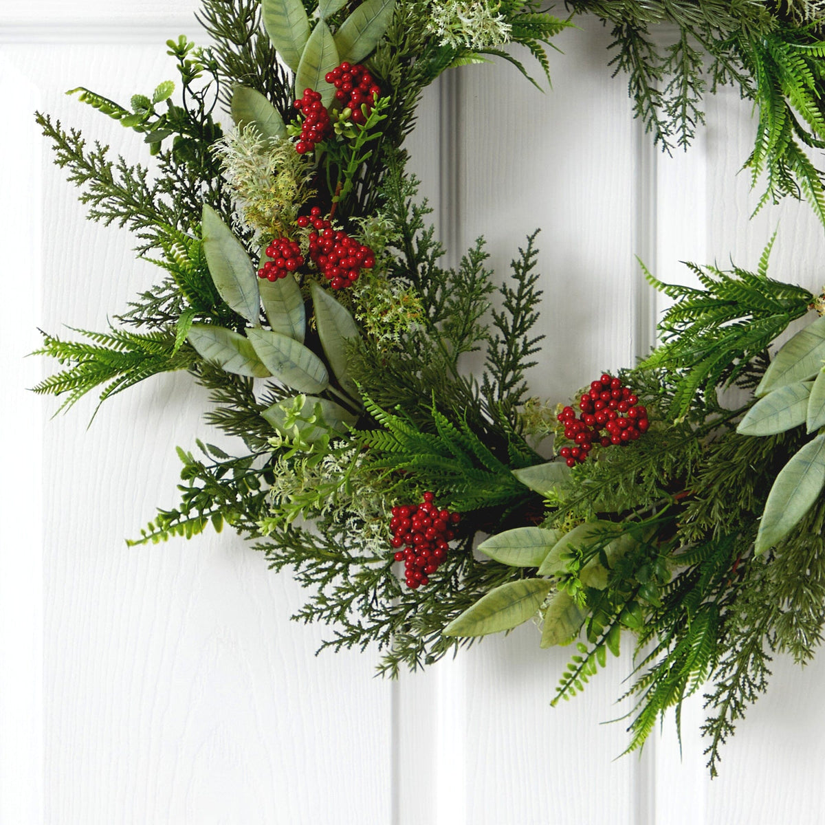 a wreath with red berries on it