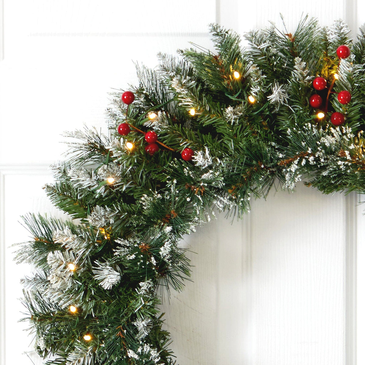 a christmas wreath on a door