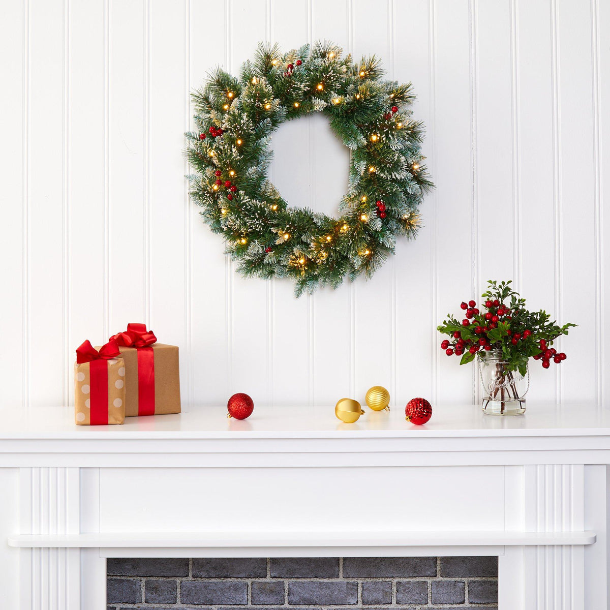 a wreath on a fireplace
