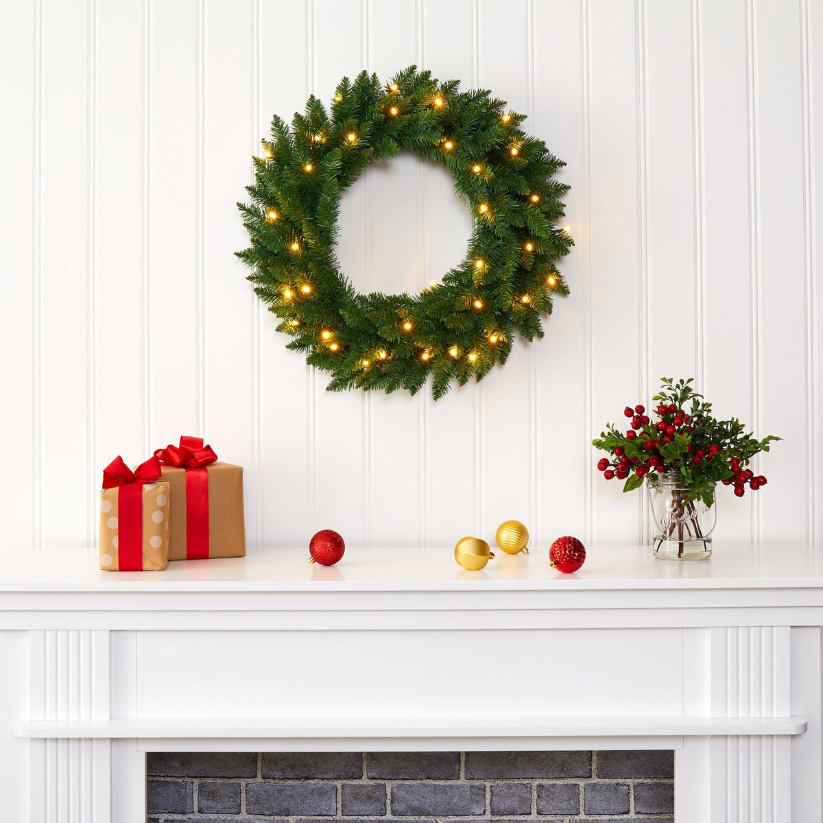 a wreath on a fireplace
