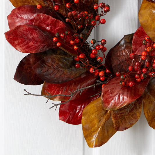 a wreath with leaves and berries