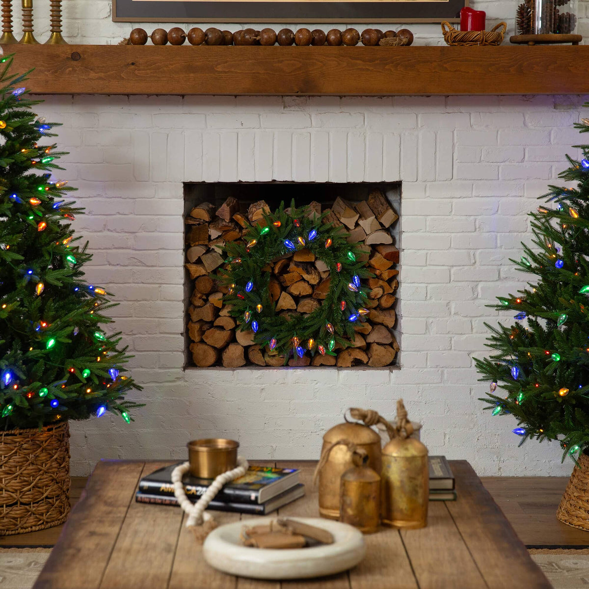 a fireplace with christmas trees and lights