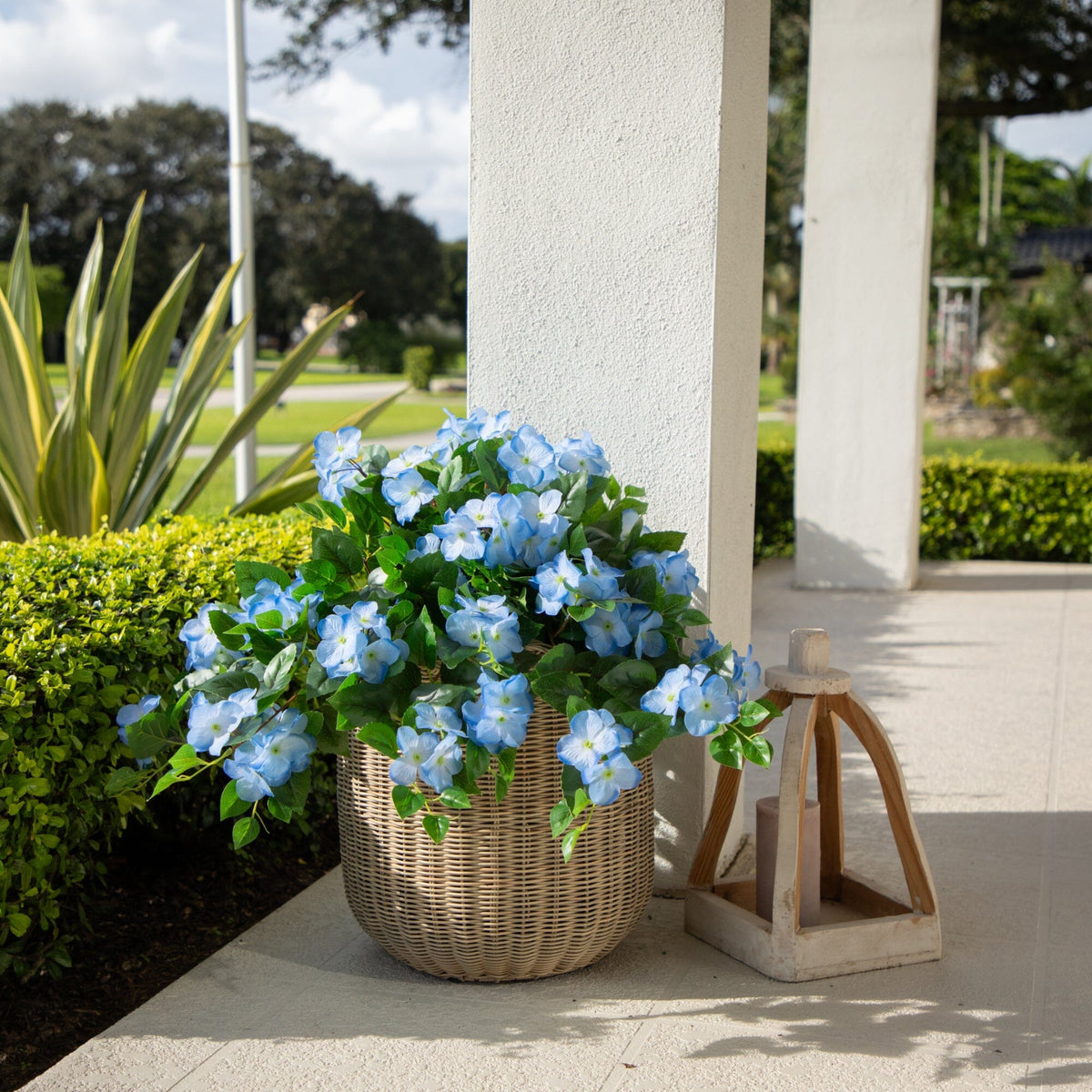 a basket of flowers on a porch
