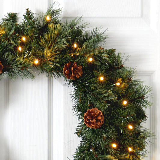 a wreath with lights and pine cones