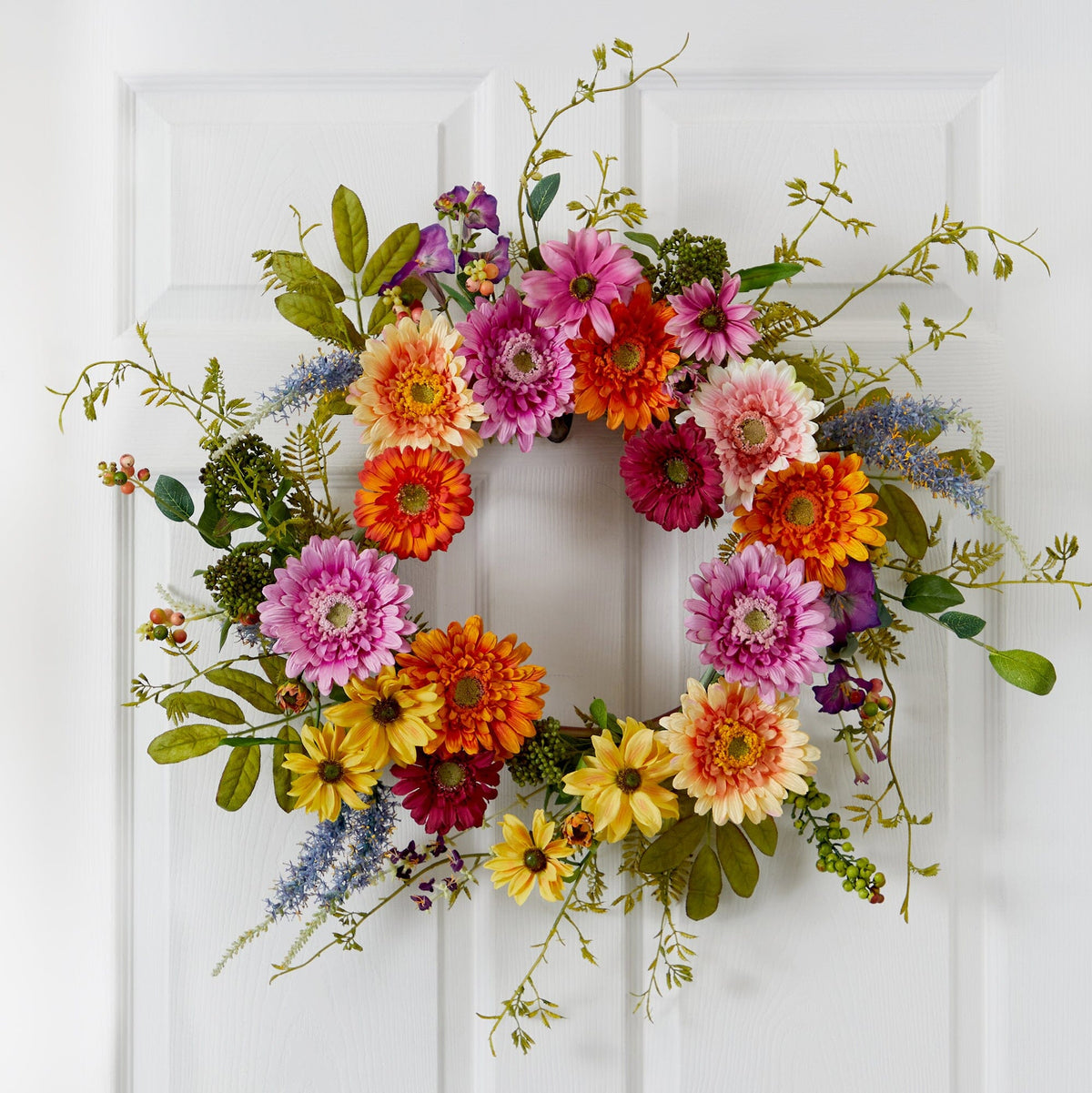 a wreath of flowers on a door