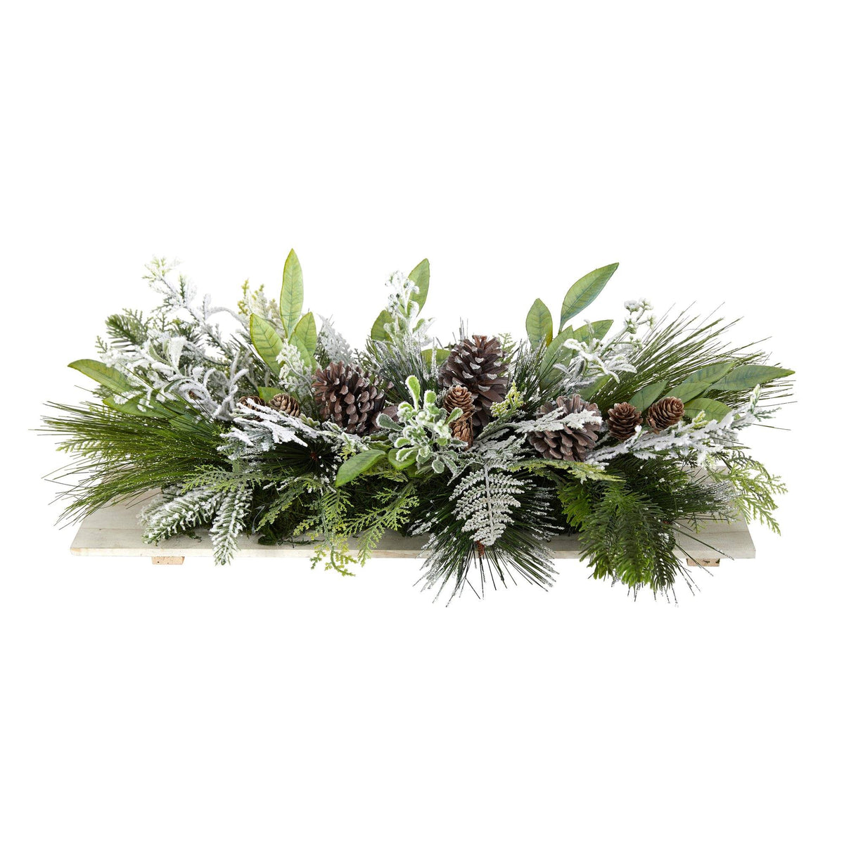 a green and white arrangement of leaves and pine cones