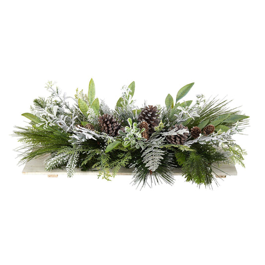 a green and white arrangement of leaves and pine cones