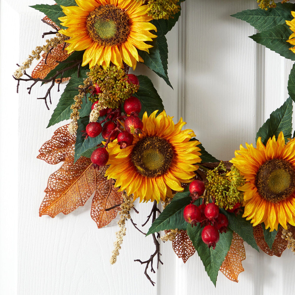 a wreath with sunflowers and leaves