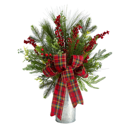 a vase with red and green plants and a red bow